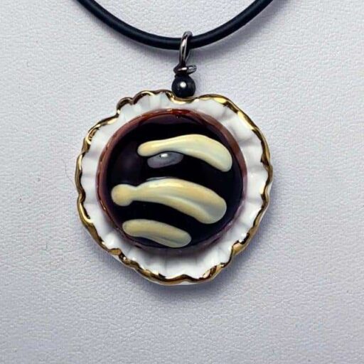 Chocolate pendant with 3 stripes of white chocolate