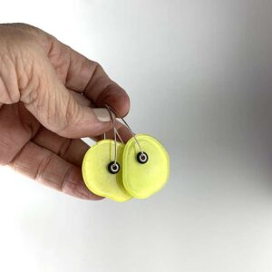 bright yellow recycled glass earrings with a green tint