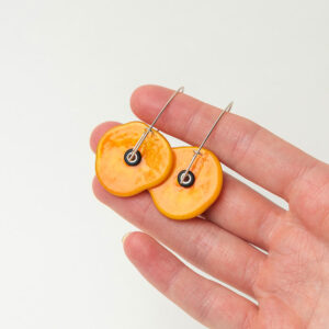 Desert Bloom Yellow earrings in hand