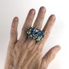 Dichroic stacked ring on hand