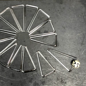 Triangle earrings with black and white beads in process
