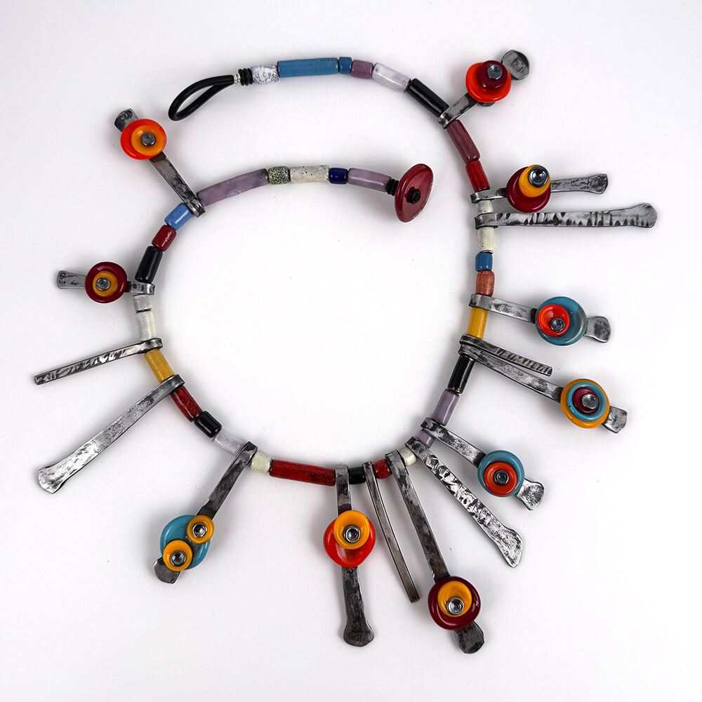 Recycled and repurposed concrete nails and copper tubing with flameworked glass