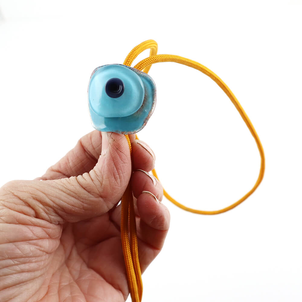 Blue on Blue bolo tie in my hand