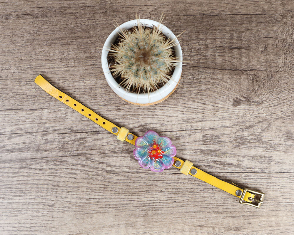 Purple flower bracelet flat lay