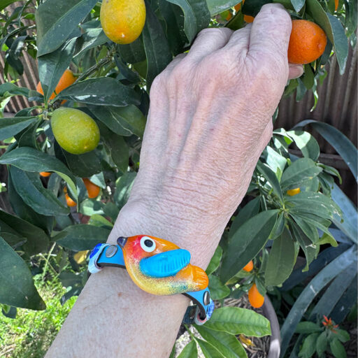 Yellow bird on wrist