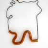 Borosilicate wiggle serpent necklace. Amber is pictured