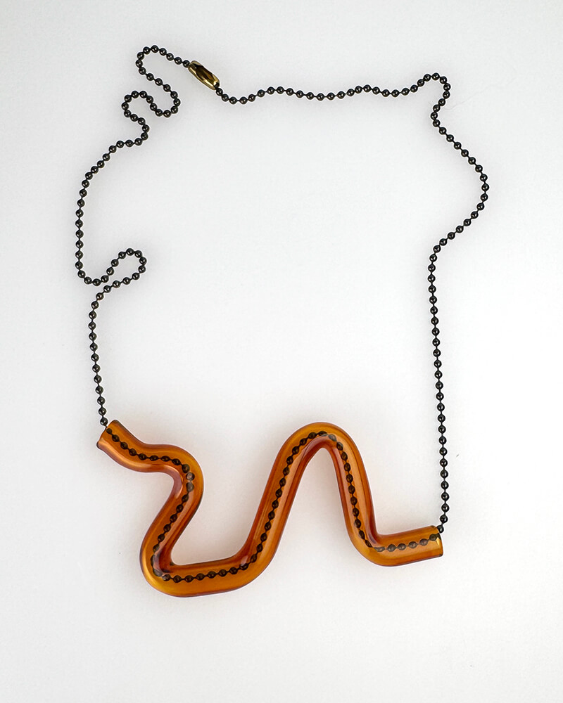 Borosilicate wiggle serpent necklace. Amber is pictured