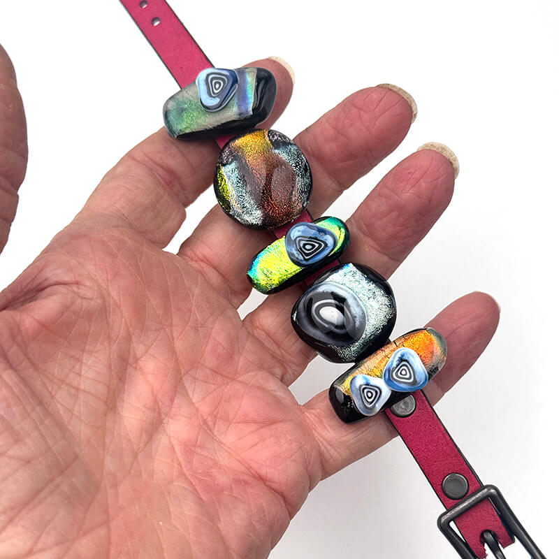 Dichroic sliders on a leather band