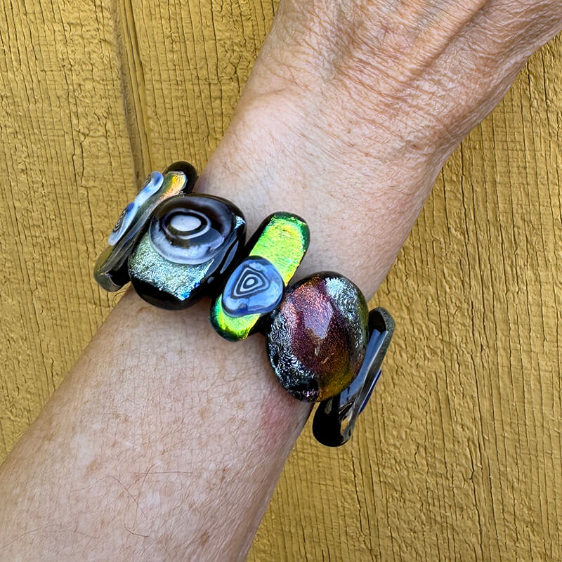 Dichroic sliders on a leather band