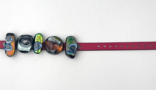 Dichroic sliders on a leather band