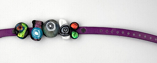 Dichroic slider bracelet with purple leather band