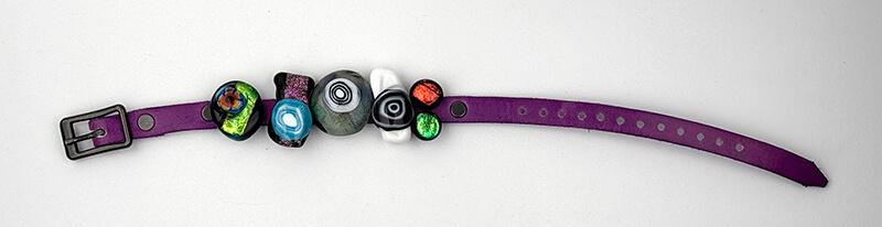 Dichroic slider bracelet with purple leather band