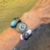 Dichroic slider bracelet with purple leather band
