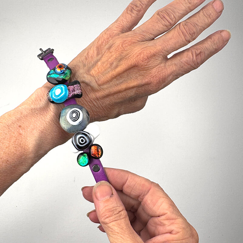 Dichroic slider bracelet with purple leather band