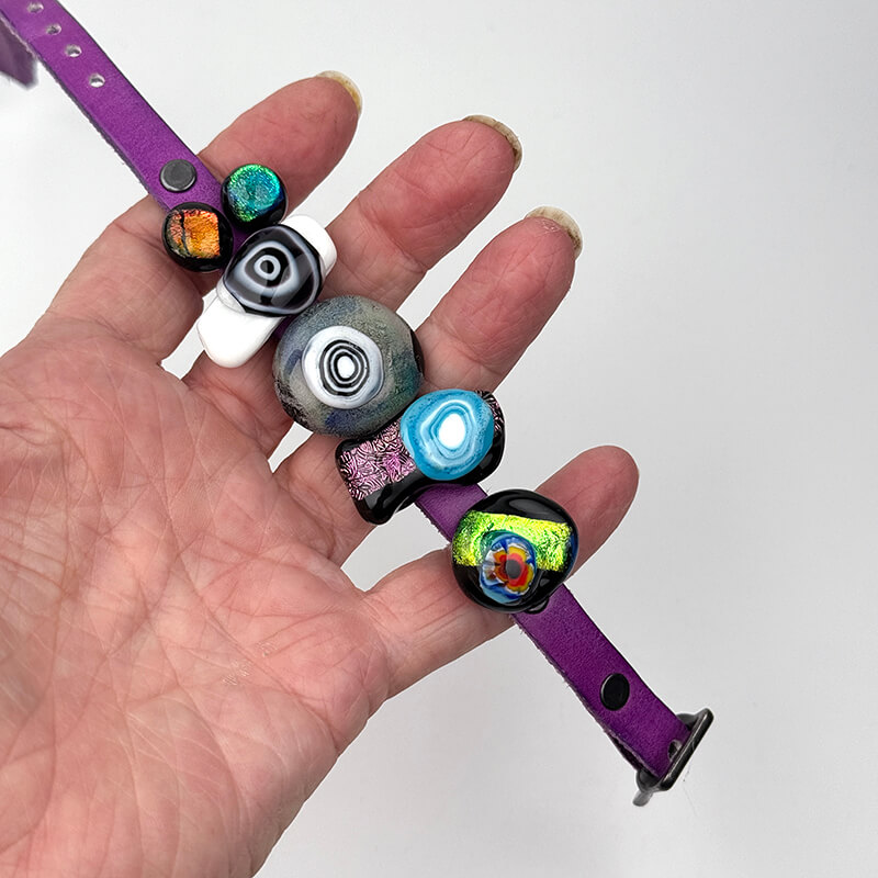 Dichroic slider bracelet with purple leather band