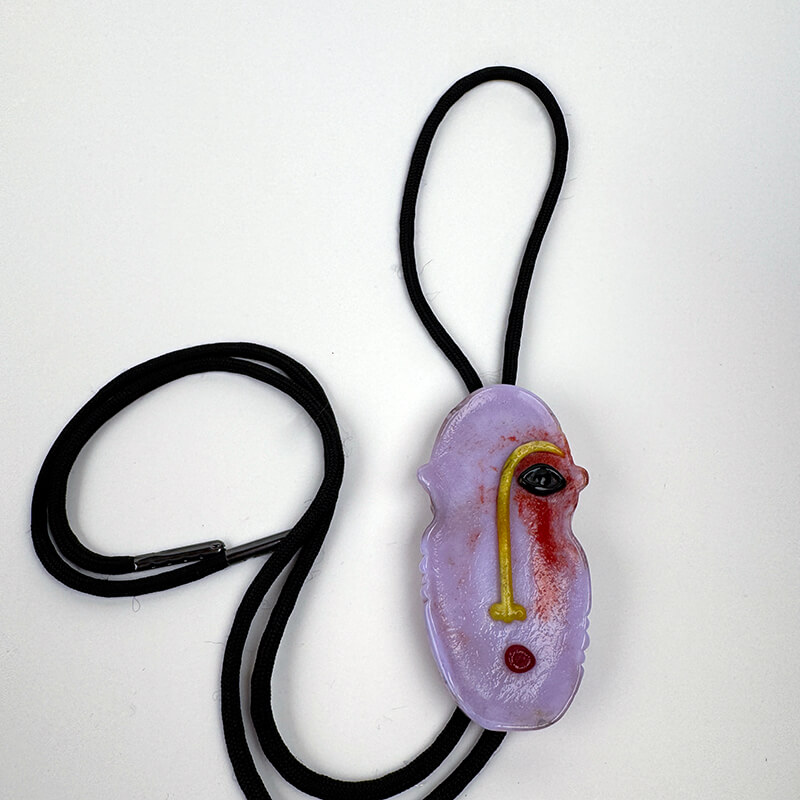 Cast and sculptured face bolo tie