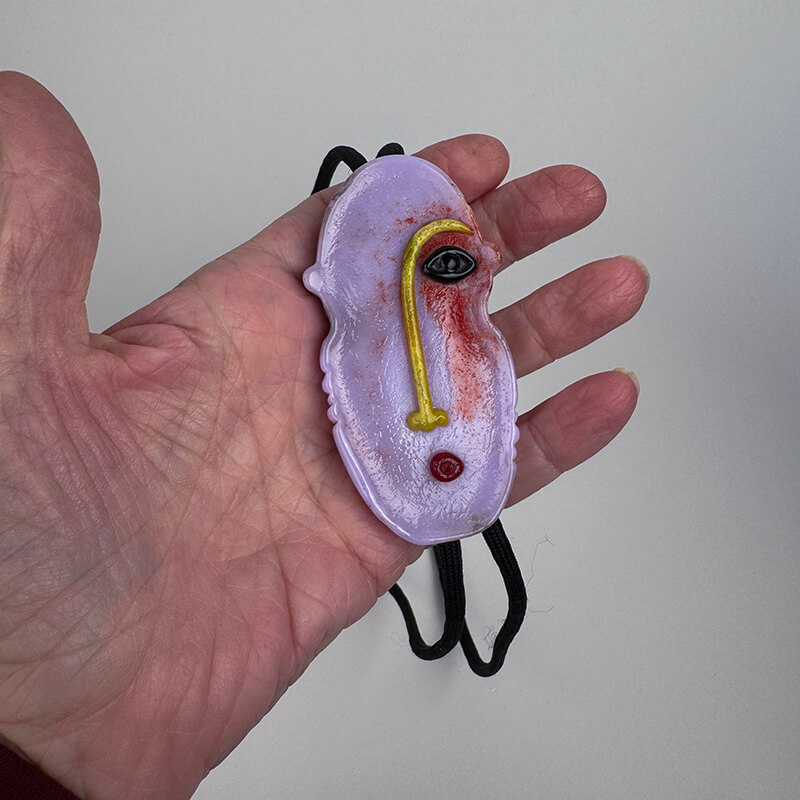 Cast and sculptured face bolo tie